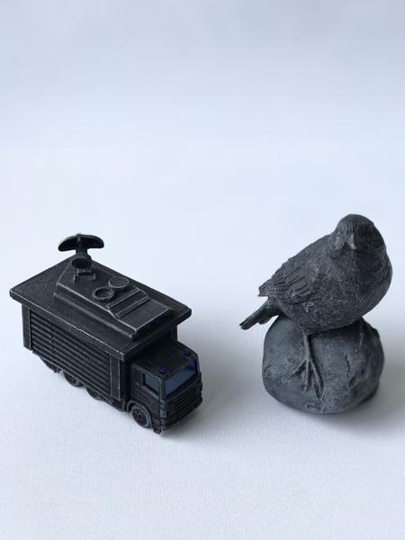 The Birds aren’t real, Plastic, m04.22, Mixed media, 4,55 cm x 8,99 cm x 8 cm, Firefighter toy car and 8 cm x 5 cm x 10 cm, Bird figurine, 2022